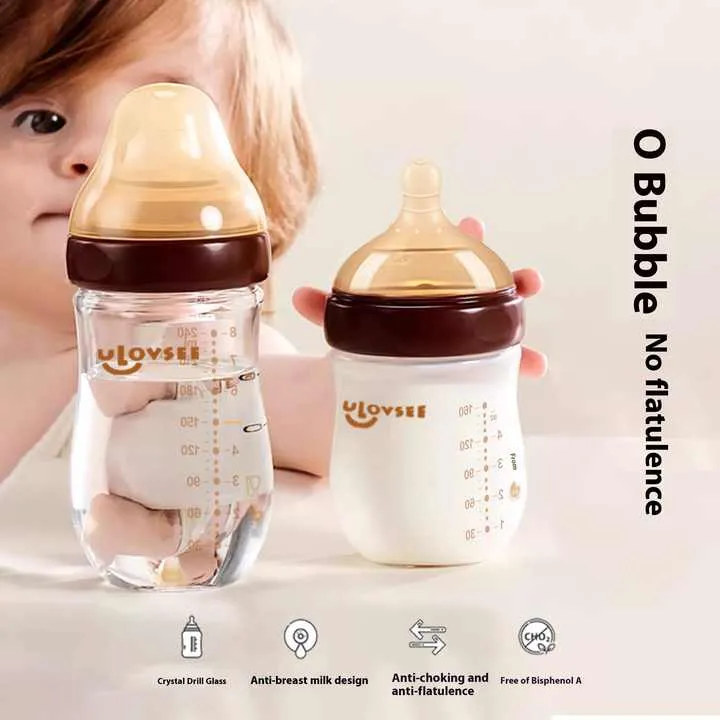 Anti-flatulence baby glass bottle nursing wide neck. زجاجة رضاعة مضادة للانتفاخ للأطفال حديثي الولادة ذات عنق